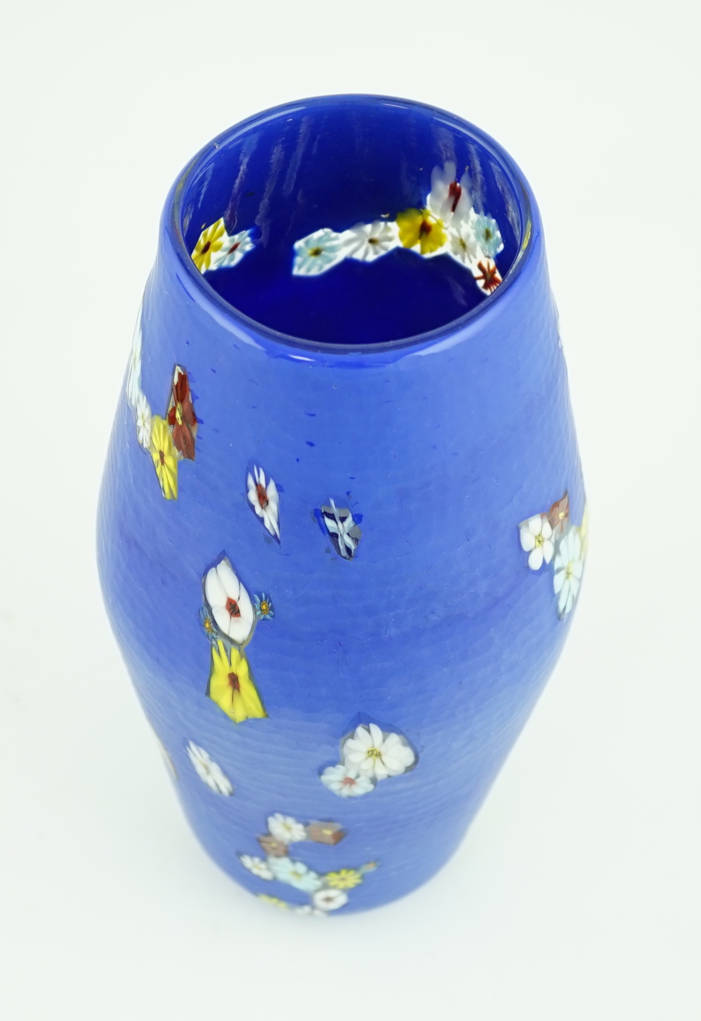 Vittorio Ferro (1932-2012) A Murano glass Murrine vase, the blue ground scattered with polychrome flowers, unsigned, 29cm, Please note this lot attracts an additional import tax of 20% on the hammer price